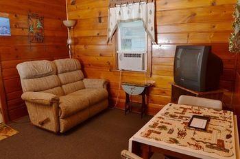 Hôtel Lucky Horseshoe Cabins à Au Sable Extérieur photo